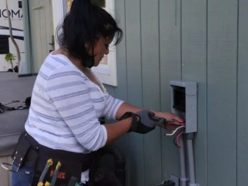 Licensed electrician wiring an exterior subpanel in Moores Mill